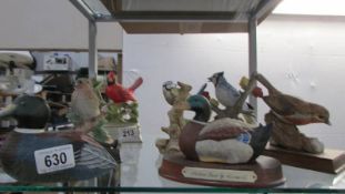 Two musical bird figures, three other birds and two ducks.