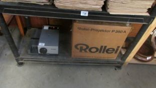 A boxed Rollei projector.