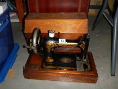 A vintage cased Singer sewing machine