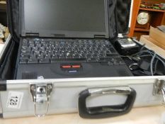 A cased IBM lap top, condition not known.