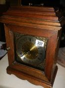 A West German brass faced clock with key ****Condition report**** Working at time