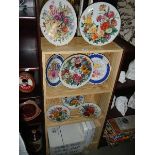 A good selection of collectors plates including German plates by Ursula Band and Chelsea flower