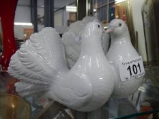 A Lladro pair of kissing doves