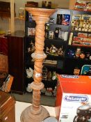 A turned mahogany torchiere/plant stand,