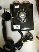 A vintage bakelite Weidmann 4259 wall mounted telephone,