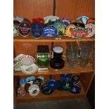 3 shelves of breweriana including pump clips, ashtrays, glasses,