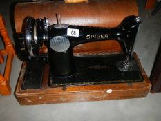 A cased vintage Singer sewing machine