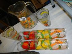 A vintage set of 6 colourful drinking glasses, a water jug and 2 other glasses,