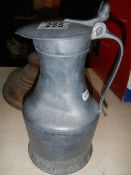 An early pewter lidded jug