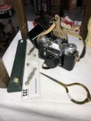 A Zenite E Moshva 80 35mm camera and slide rule + 1 other and map dividers