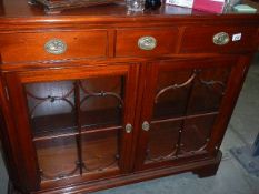 A good quality modern mahogany astragal glazed cabinet.