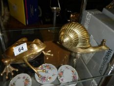 A large brass frog and snail ornament