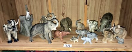 A collection of pottery elephants etc