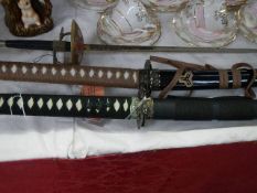 2 ornamental Samurai swords and a fencing foil