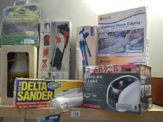 A quantity of boxed items including tube cutter, sander, lamp etc,