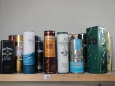A quantity of empty advertising whisky bottle tins etc