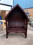 A garden canopy seat ****Condition report**** There are nuts & bolts holding it