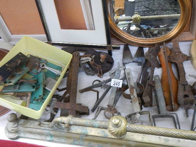 A quantity of vintage iron animal traps and a vintage Harras bean slicer etc.