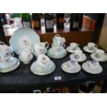 A Royal Worcester set 6 coffee cups and saucers and a Royal Albert 'Elfin' tea set