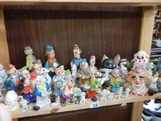 A shelf of clowns including Pierrot