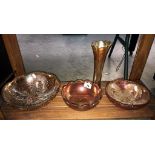 A large carnival glass fruit bowl plus 2 others and a vase