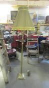 A brass standard lamp with reeded column complete with shade. (Collect only).