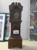 A 19/20th century Grandfather clock pocket watch stand with inlaid door panel.