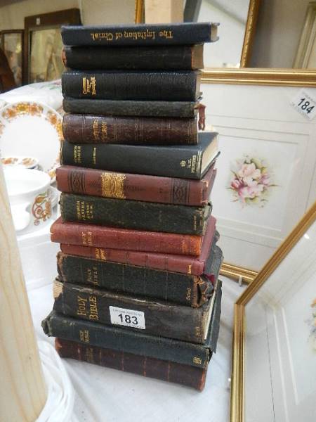 A collection of Bibles and Prayer books.
