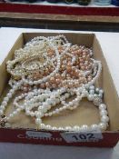 A mixed lot of faux pearl necklaces