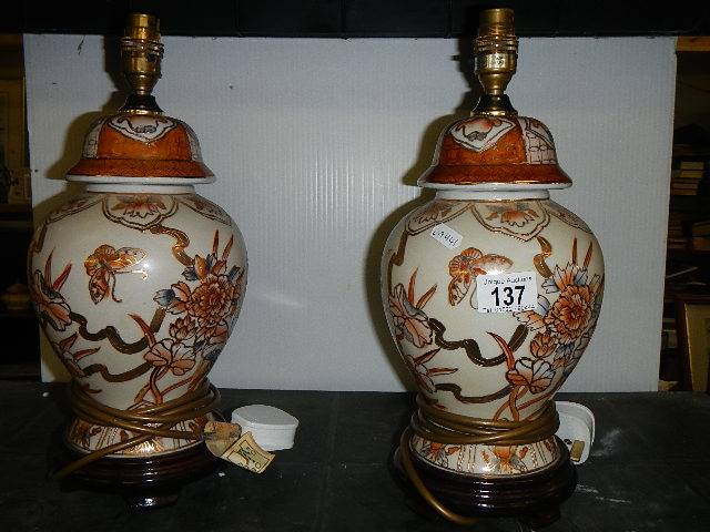 A pair of Chinese style ginger jar table lamps