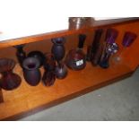 A large quantity of vintage purple art glassware including vases