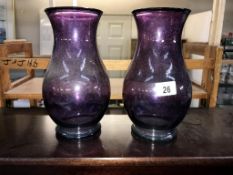 A pair of purple art glass vases