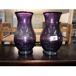 A pair of purple art glass vases