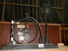 A vintage scratch built table lamp of a penny farthing next to lamp post ****Condition