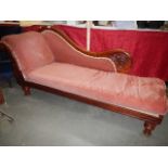 A mahogany framed chaise longue.