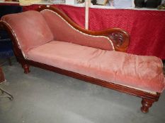 A mahogany framed chaise longue.