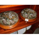 A pair of Victorian mahogany based foot stools with beaded tapestry covers