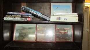 A quantity of aircraft and war related books together with three framed Red Arrows photographs.