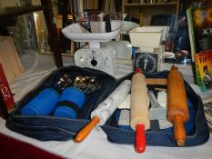 A mixed lot including rolling pins, scales and picnic set.