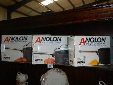 A fabulous set of 3 boxed Anolon professional saucepans,