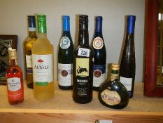 Eight bottles of assorted wine.