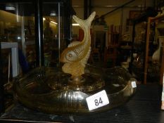 An art deco yellow glass table centre piece with leaping fish