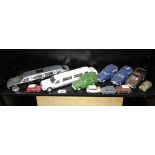 A quantity of unboxed diecast Morris Minor vans and Mini model cars