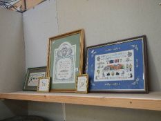 Five framed and glazed cross stitch pictures.