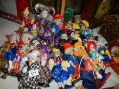 A large collection of clown dolls.