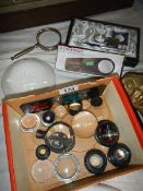 A quantity of magnifying glasses and lenses.