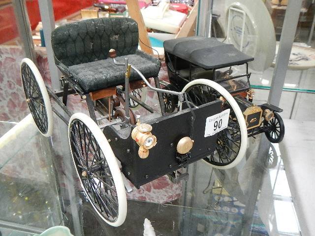 A Franklin Mint 1896 Ford quadricycle and Model T Ford