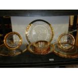 A gold rimmed cake stand,