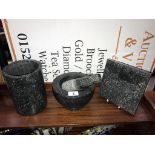 A granite pestle and mortar,