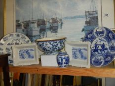 A mixed lot of blue and white including bowl, commemorative plates,